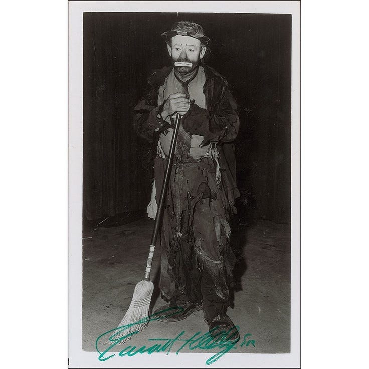 Emmett Kelly sweeping the spot light under the rug.