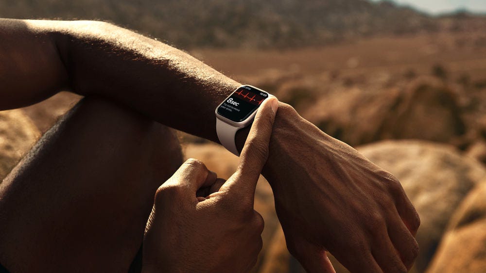 A man wearing an Apple Watch A man wearing an Apple Watch