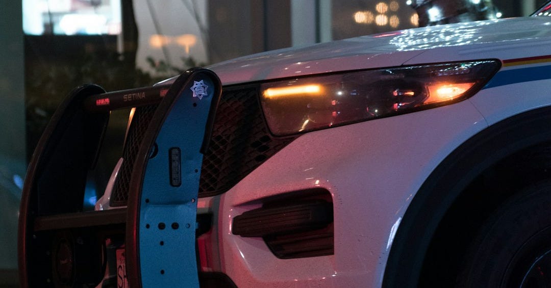 a police car parked on the side of the road