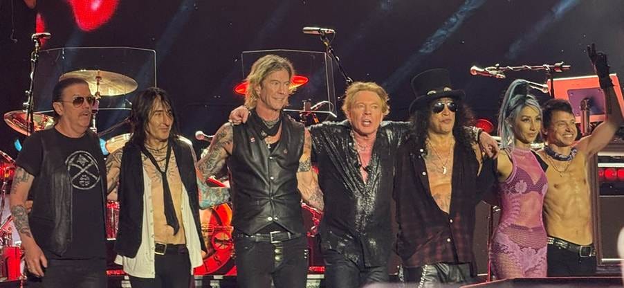 Guns N' Roses 2025 line-up. From L to R: Dizzy Reed, Richard Fortus, Duff McKagan, Axl Rose, Slash, Melissa Reese, and Isaac Carpenter. Picture Credit: Wikipedia Guns N' Roses 2025 line-up. From L to R: Dizzy Reed, Richard Fortus, Duff McKagan, Axl Rose, Slash, Melissa Reese, and Isaac Carpenter. Picture Credit: Wikipedia
