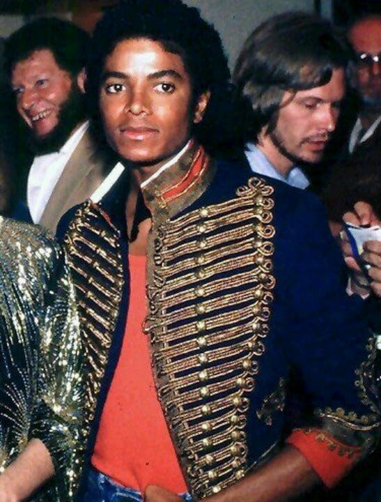 Off The Wall Era: Red Shirt, Miltiary style blue jacket with gold and red  imprints. Includes Blue Jeans Off The Wall Era: Red Shirt, Miltiary style blue jacket with gold and red  imprints. Includes Blue Jeans