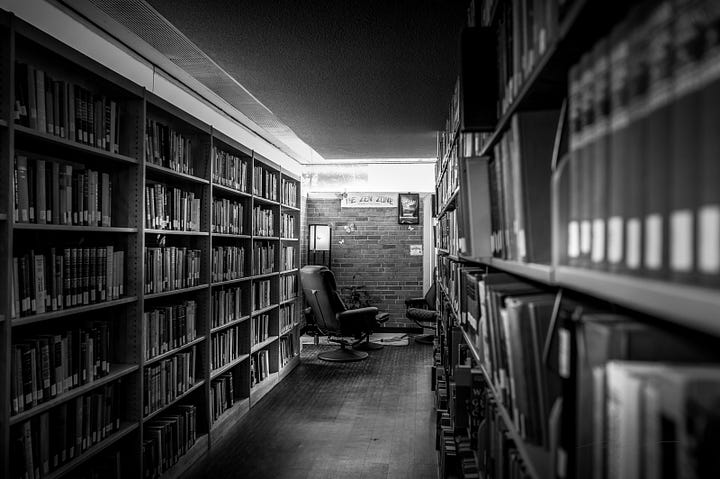 scenes from the library including mosaic artwork and poem, repurposed card catalog, study areas, books, and Black authors
