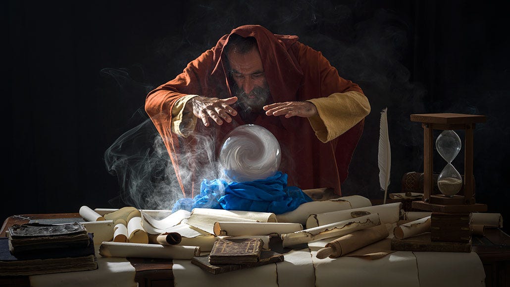 a man peering into a crystal ball a man peering into a crystal ball