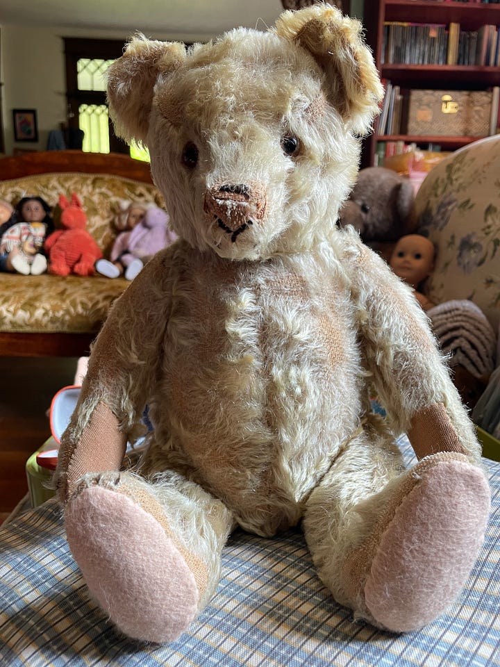 An antique teddy bear being repaired.