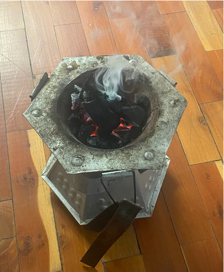 Metal charcoal stove in Addis Ababa, Ethiopia, illustrating household energy stacking.