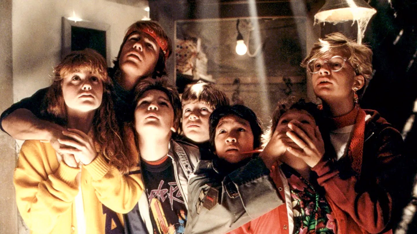 A group of kids huddle together in awe, bathed in a beam of light cutting through an attic ceiling. Their wide eyes and rapt expressions are lit by the glow, surrounded by shadows and cobwebs. A group of kids huddle together in awe, bathed in a beam of light cutting through an attic ceiling. Their wide eyes and rapt expressions are lit by the glow, surrounded by shadows and cobwebs.