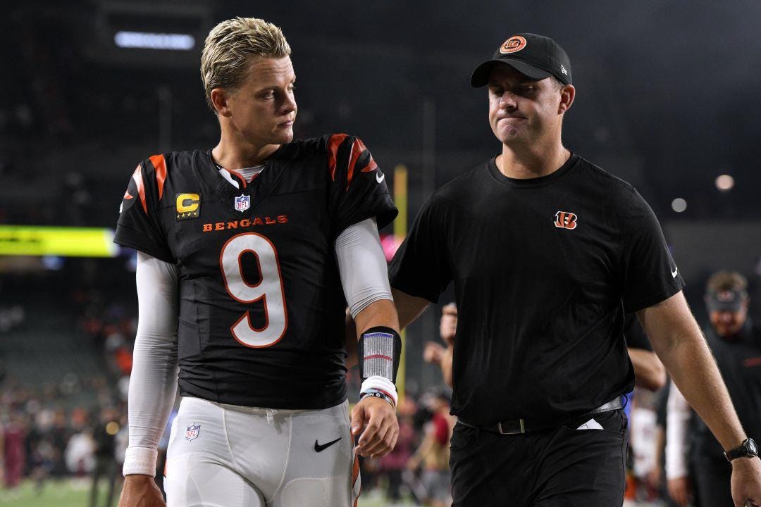Cincinnati Bengals quarterback Joe Burrow (9) walks off the field with head  coach Zac Taylor after an NFL football game against the Washington  Commanders, Monday, Sept. 23, 2024, in Cincinnati. The Commanders