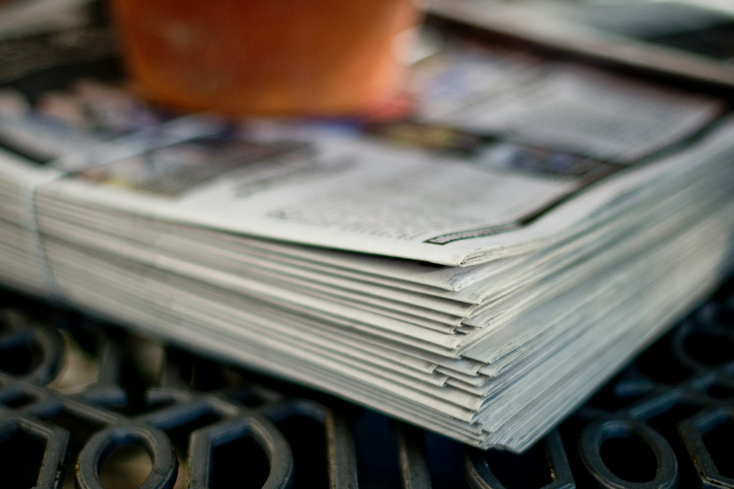 Photo of a stack of newspapers Photo of a stack of newspapers