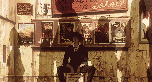 This may contain: a man sitting on top of a bench in front of a wall covered with posters