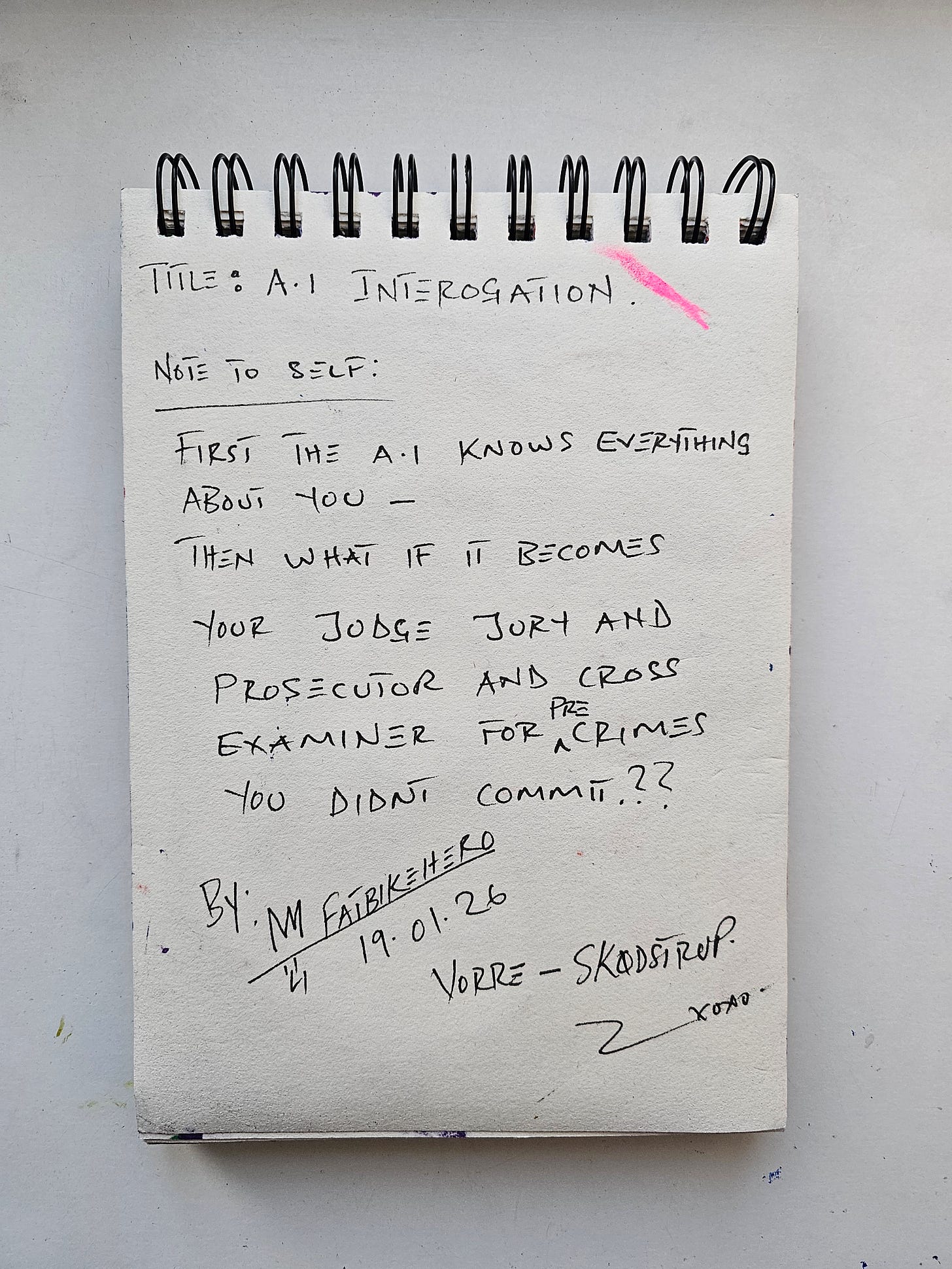 Alt Text: The back of a sketchbook page by FatbikeHero showing handwritten notes in black ink. The text reads "Title: A.I Interrogation" and questions whether AI, after knowing everything about a person, will become a judge and prosecutor for "pre-crimes" the subject hasn't committed yet. Signed and dated 19.01.26, Vorre-Skødstrup.