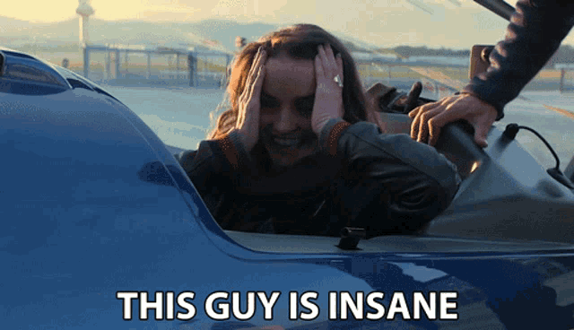 a woman in a car with the words this guy is insane a woman in a car with the words this guy is insane