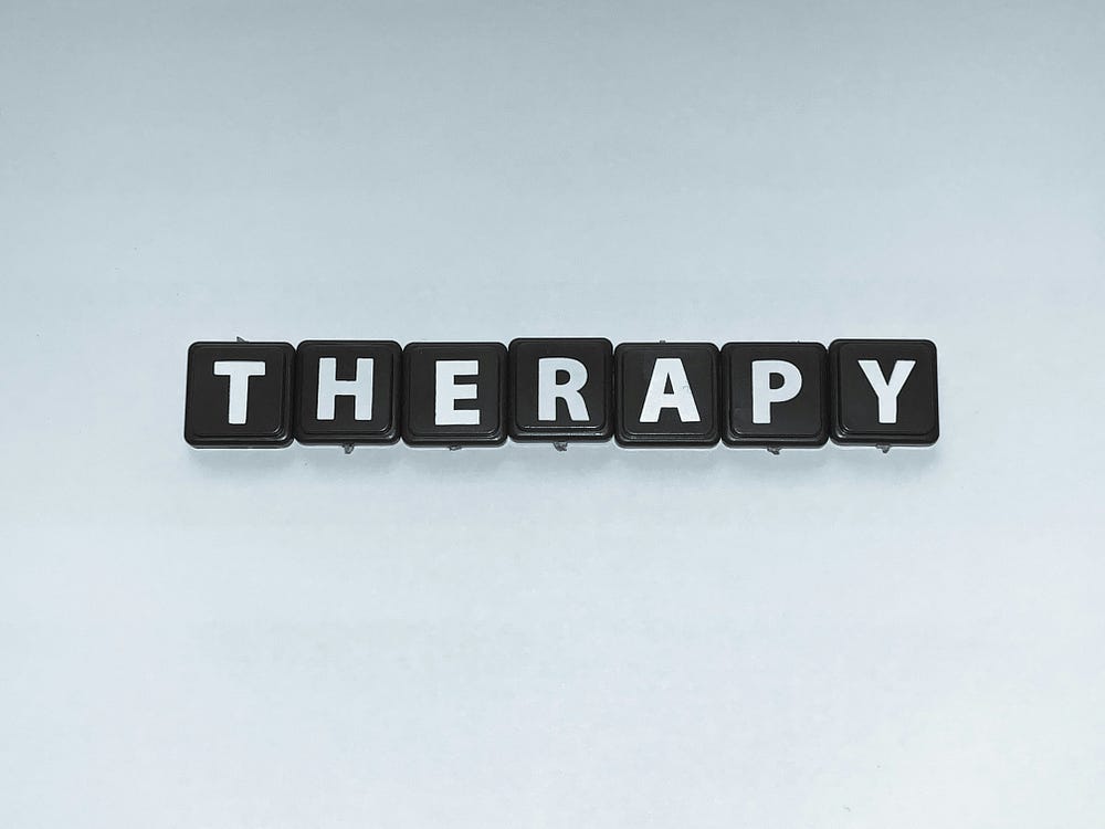 The word ‘THERAPY’ spelled out with the keys from a keyboard. The word ‘THERAPY’ spelled out with the keys from a keyboard.