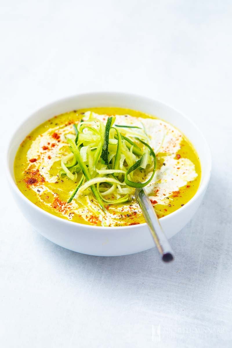 A bowl of bright green zucchini and leek soup A bowl of bright green zucchini and leek soup