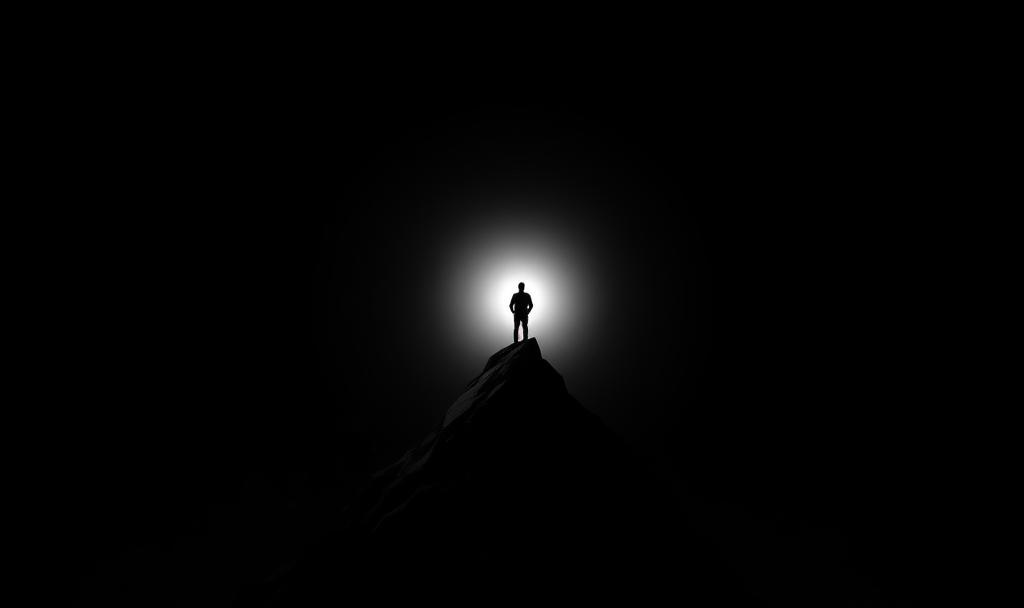 Solitary silhouette on a peak, symbolizing the Absoluteness of Rational Egoism.