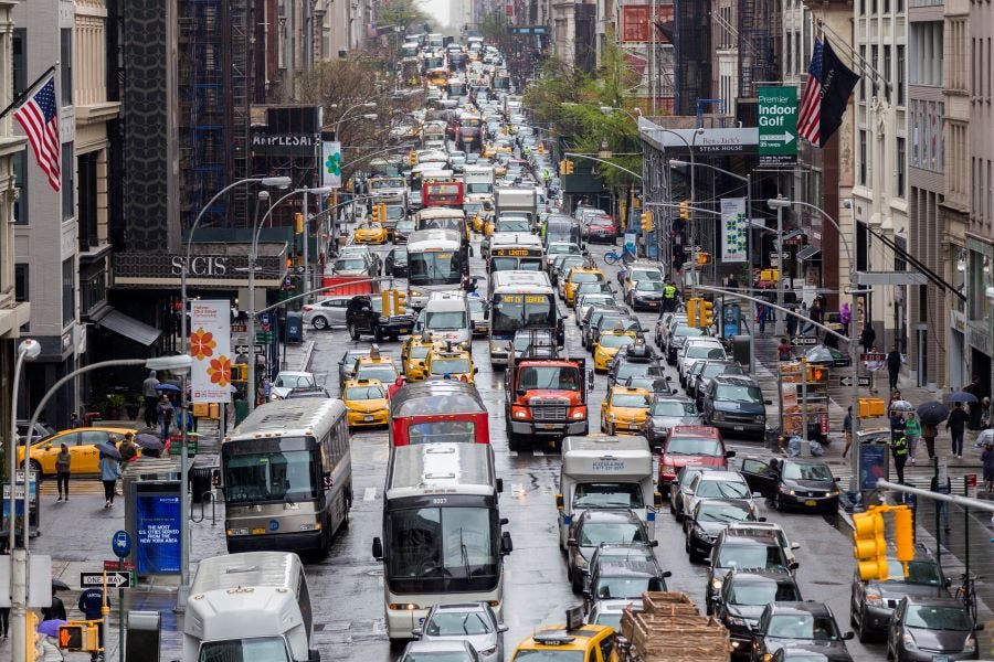 Dense traffic along a main avenue in Manhattan