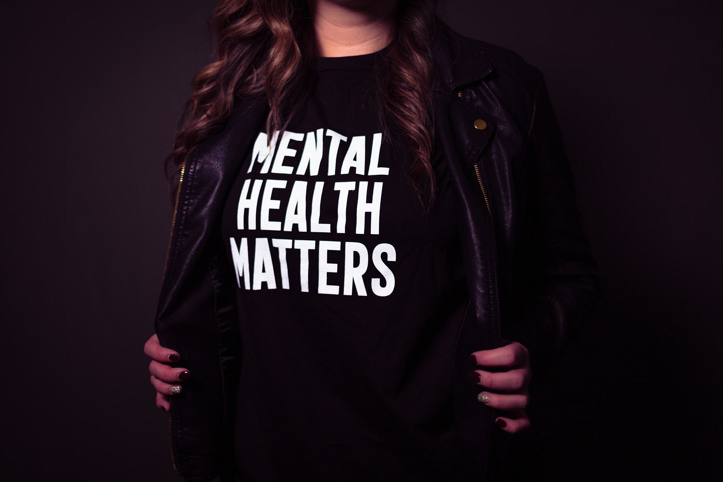 Person wearing t-shirt that says, "Mental Health Matters." Person wearing t-shirt that says, "Mental Health Matters."