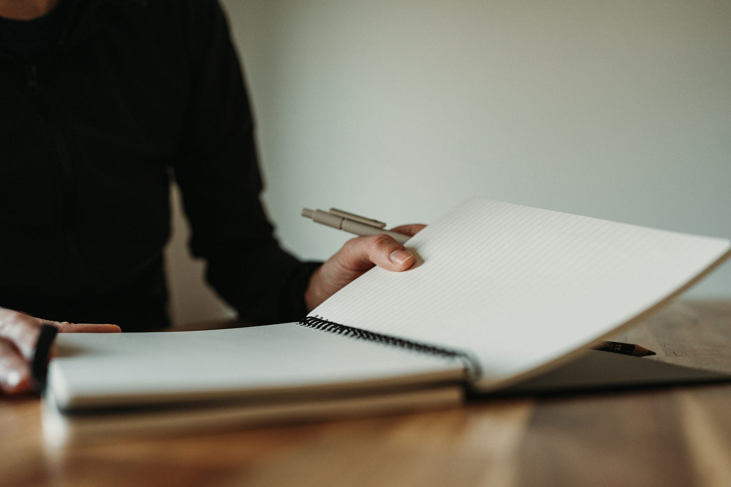 photo of writer with open blank journal photo of writer with open blank journal