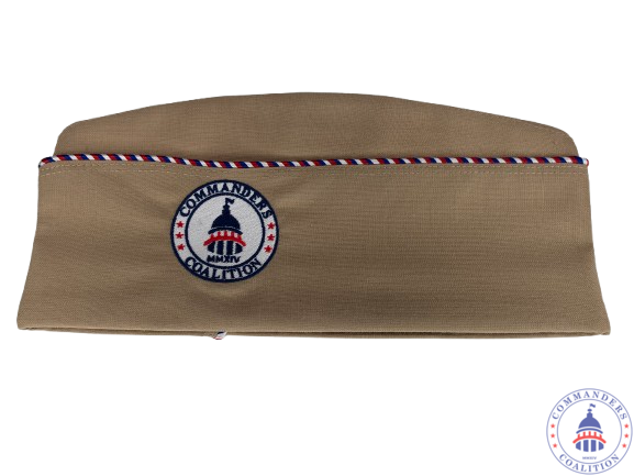 A khaki military-style garrison cap, isolated on a plain background, with red–white–blue braided piping along the top seam. On the side is a circular embroidered patch showing the U.S. Capitol dome with stars and the words “Commanders Coalition.” A khaki military-style garrison cap, isolated on a plain background, with red–white–blue braided piping along the top seam. On the side is a circular embroidered patch showing the U.S. Capitol dome with stars and the words “Commanders Coalition.”