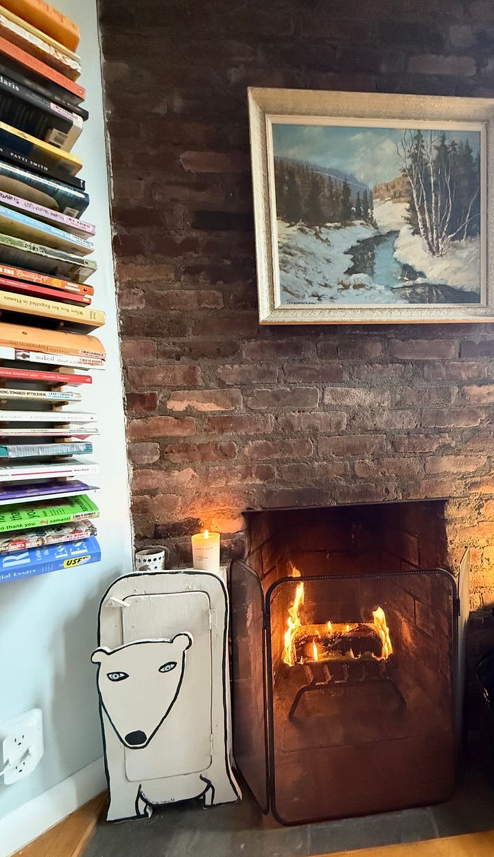 White bear cabinet next to a fireplace