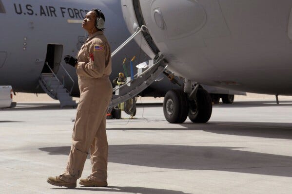 In this image provided by the U.S. Air Force, Staff Sgt. Krysteena Scales, a 816th Expeditionary Airlift Squadron Flying Crew Chief, performs pre-flight checks before departing on a mission in a C-17 Globemaster III, March 19, 2009, at an undisclosed location in Southwest Asia. (Senior Airman Andrew Satran/U.S. Air Force via AP) In this image provided by the U.S. Air Force, Staff Sgt. Krysteena Scales, a 816th Expeditionary Airlift Squadron Flying Crew Chief, performs pre-flight checks before departing on a mission in a C-17 Globemaster III, March 19, 2009, at an undisclosed location in Southwest Asia. (Senior Airman Andrew Satran/U.S. Air Force via AP)