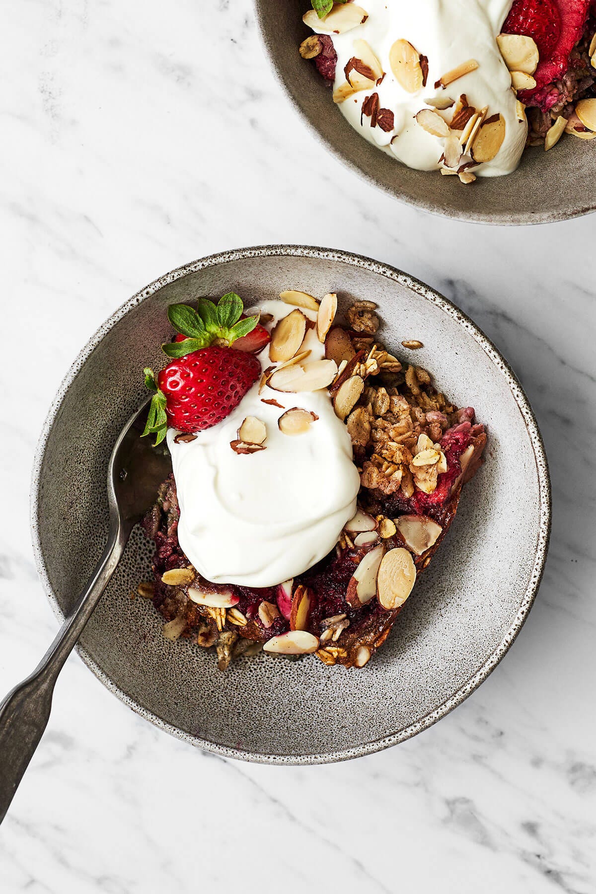 Berry baked oatmeal in a bowl with yogurt