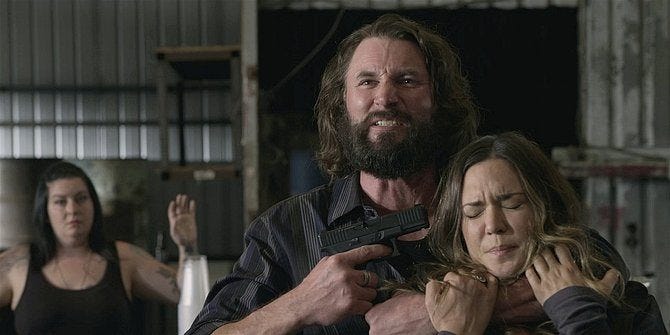 Walker Oswald holding gun to Geri Cali head. Walker Oswald holding gun to Geri Cali head.