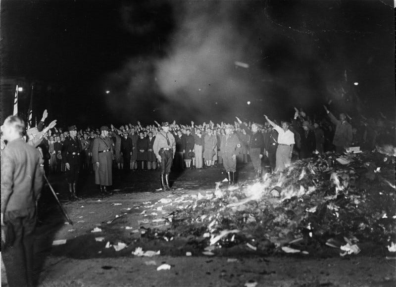 Image of German nazi supporters burning books in the 1930s