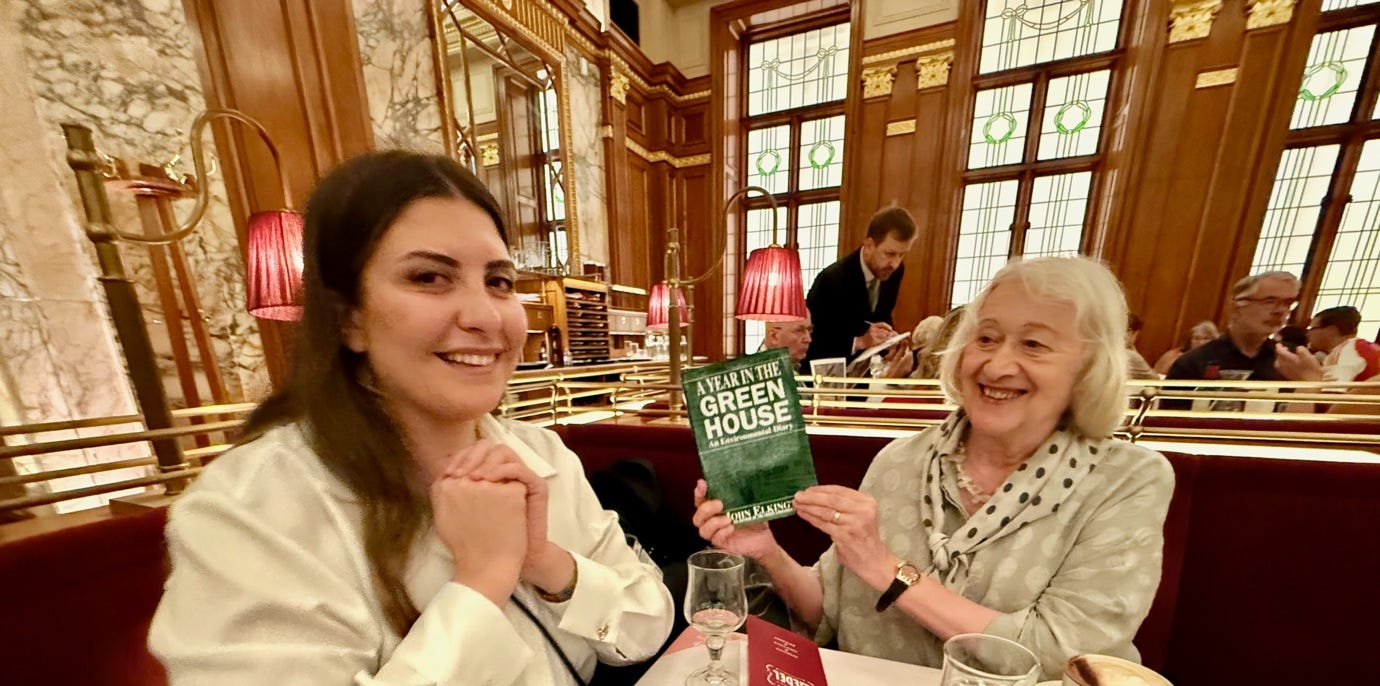 A person holding a book and smiling at the camera

AI-generated content may be incorrect.