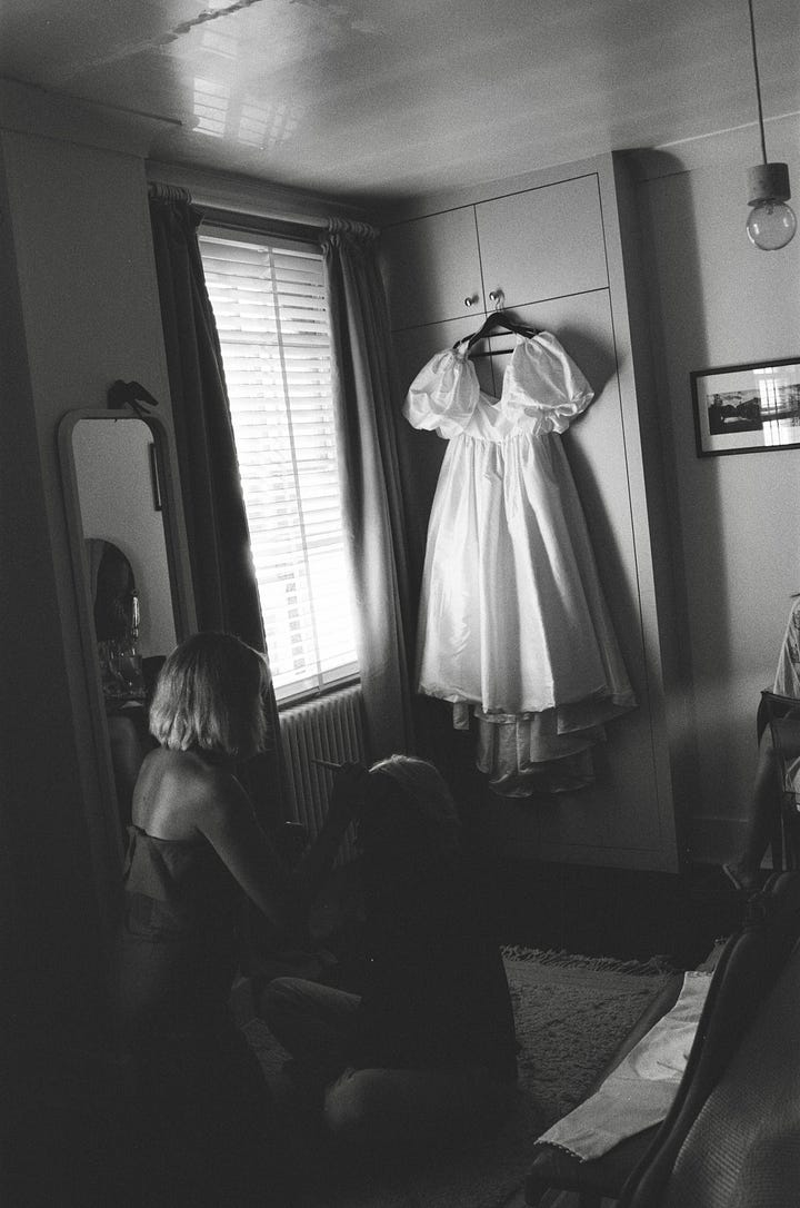 A bride getting dressed before her wedding