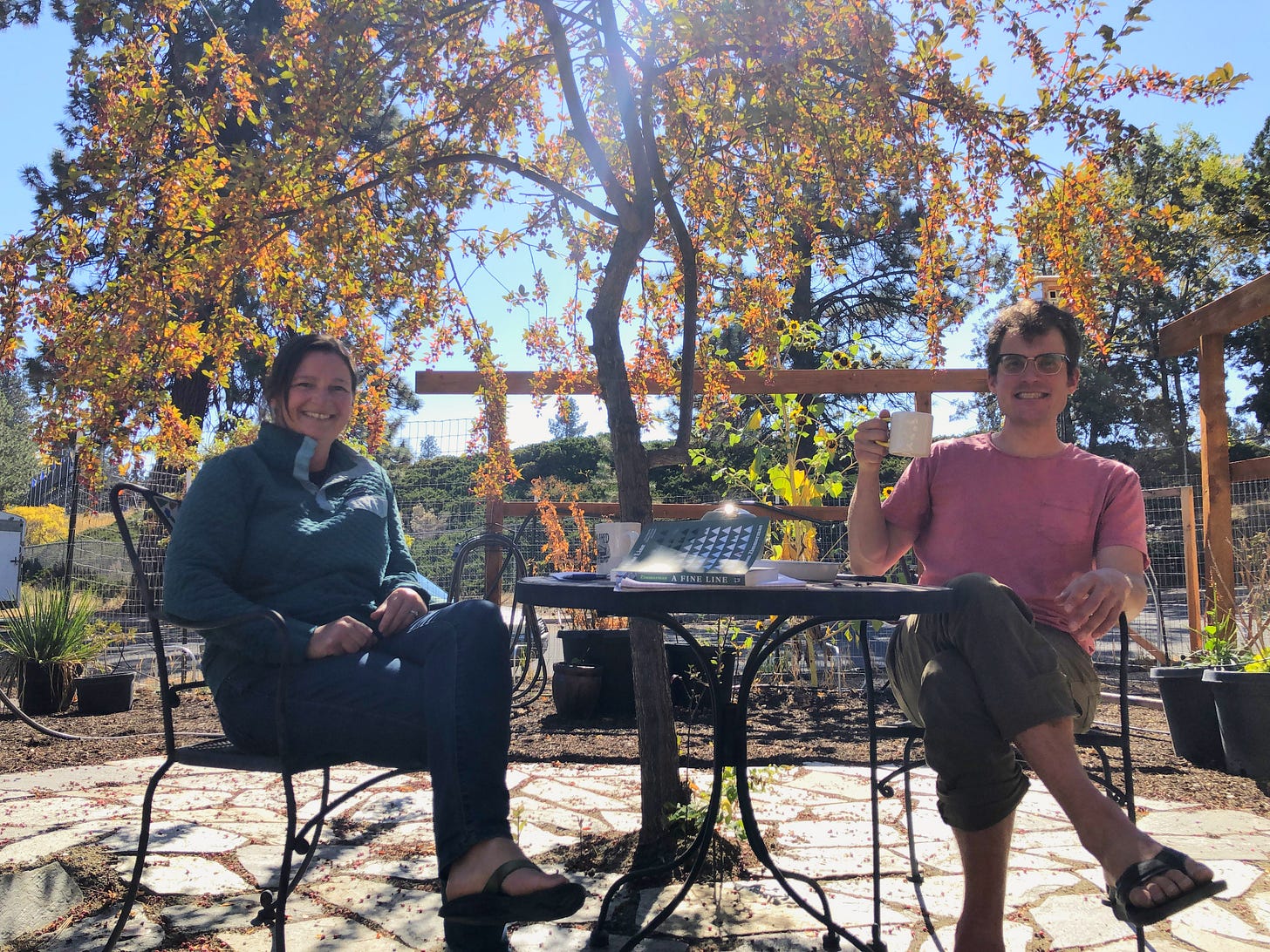 Graham and Meghan drinking tea on sunny patio