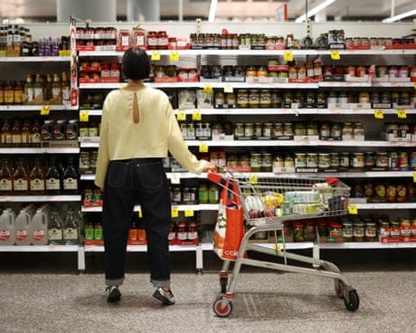A shopper looks at items displayed on a shelf at at Coles supermarket in Sydney A shopper looks at items displayed on a shelf at at Coles supermarket in Sydney