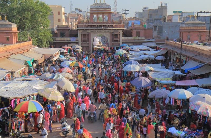 People visit Sardar street market in Jodhpur India. Busy bazaar stock images, royalty-free photos and pictures