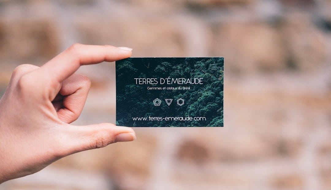 person holding black and white card