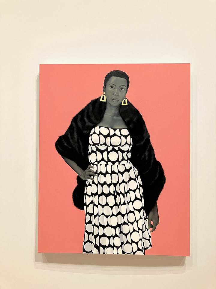 four full-length paintings of Black people in bright outfits against yellow, blue and orange backgrounds.