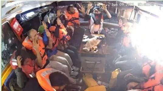 Madleen passengers raise their hands as the IDF boards their ship