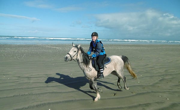 It isn't easy getting a camera out and taking a photo while you're cantering, but this picture of Aurora Naseebah and Kimberley running along Oreti Beach proves it can be done! It isn't easy getting a camera out and taking a photo while you're cantering, but this picture of Aurora Naseebah and Kimberley running along Oreti Beach proves it can be done!