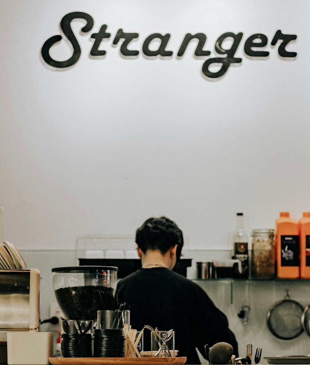 man in black sweater standing in kitchen man in black sweater standing in kitchen