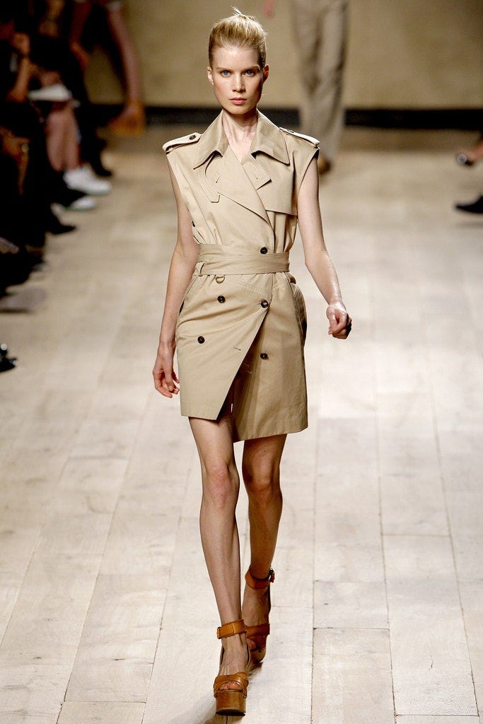 Image may contain Human Person Clothing Apparel Overcoat and Coat