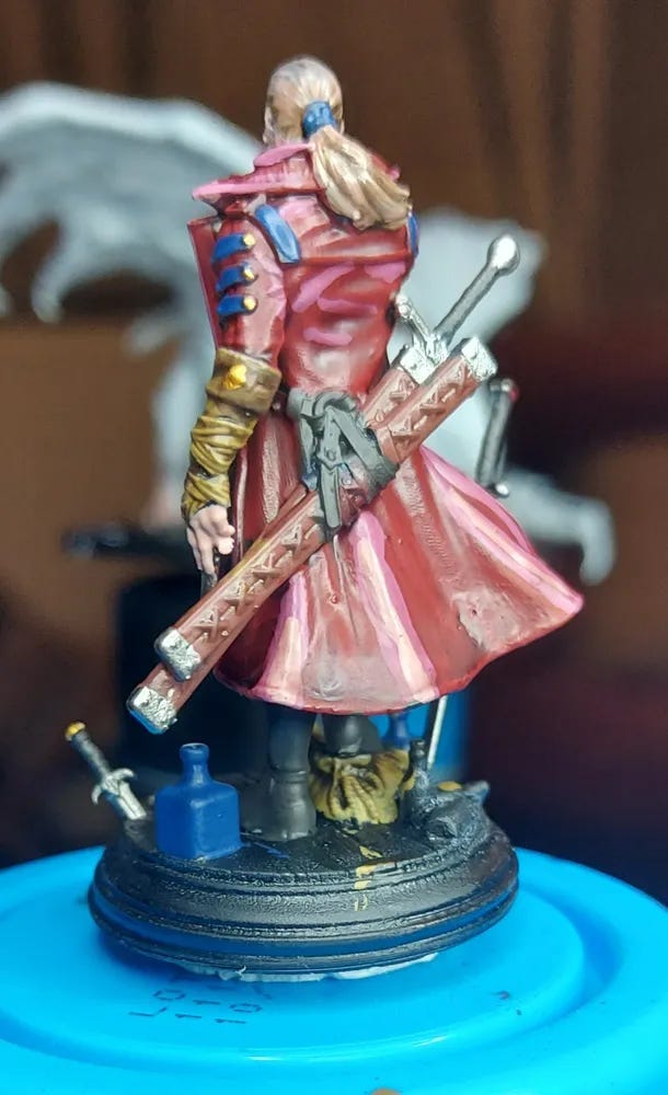 A miniature human character seen from the back, for use in a DND campaign. Brilliant red coat. A miniature human character seen from the back, for use in a DND campaign. Brilliant red coat.
