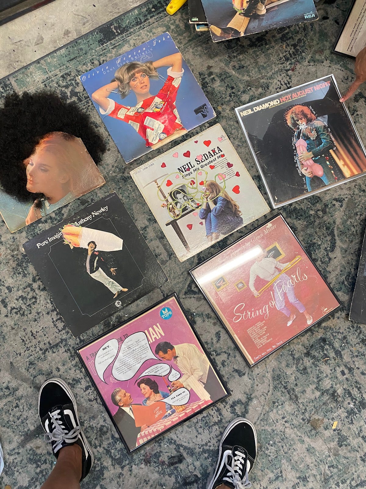 Left to right top to bottom: 	1.	Can I Touch Your Hair?, 2013. wig and record cover. 12.5” x 12.5” 	2.	TVP, 2013. Vintage baby food labels, paper clips, colored pencil, paint marker on record cover. 12.5” x 12.5” 	3.	Pure Imagination (Shit Sandwich) 2014. Photo collage, tracing paper, acrylic on record cover. 12.5” x 12.5” 	4.	A Really Devoted Fan, 2013. Colored pencil, paper, sequins on record cover. 12.5” x 12.5” 	5.	I Love Myself So much I’d Swallow, 2012. colored pencil, paper, acrylic on record cover. 12.5” x 12.5” 	6.	Regular Food, 2014. Inkjet print on pearlescent paper, record cover. 12.5” x 12.5” 	7.	Bands Will Make Her Dance, 2012. Photo, colored pencil on paper, rubber band. 12.5” x 12.5”