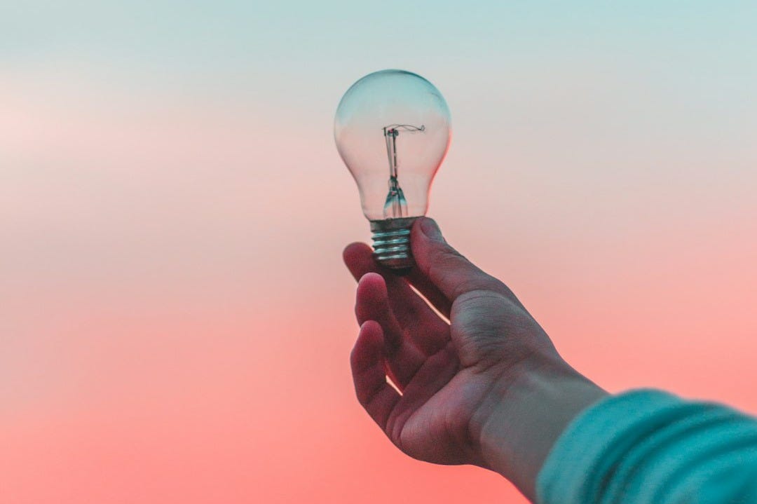person holding light bulb
