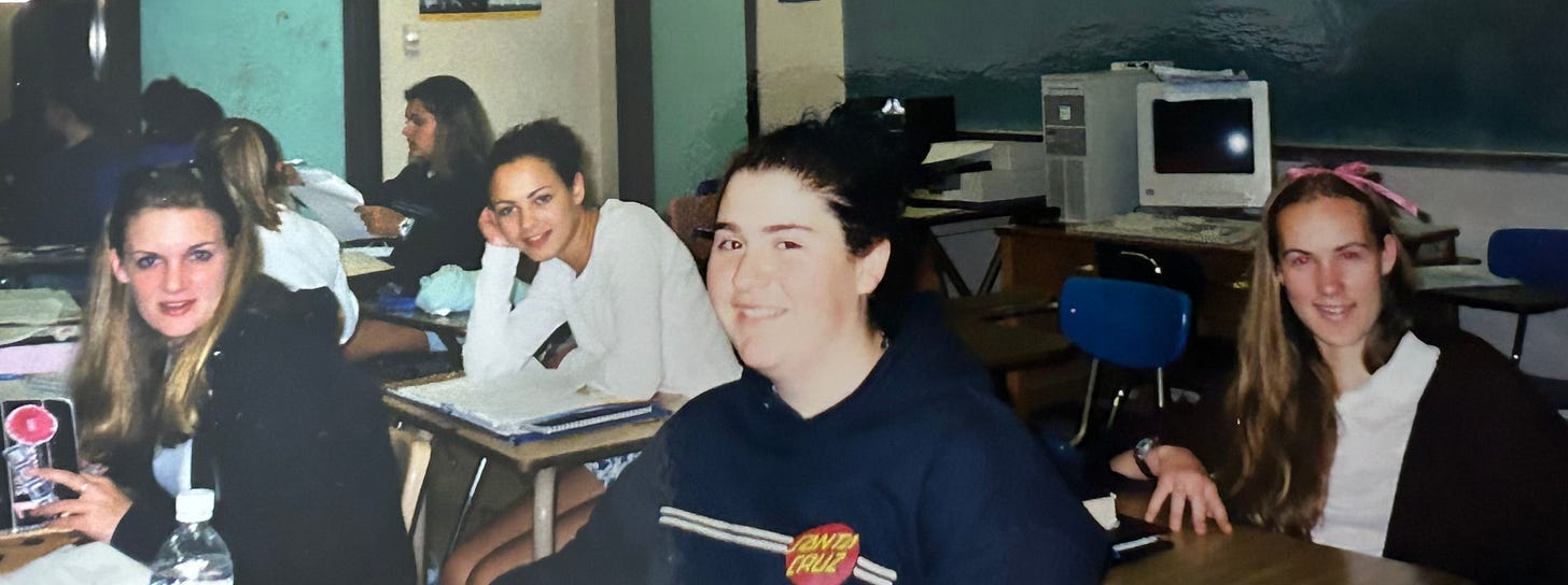 four teen girls in school desks