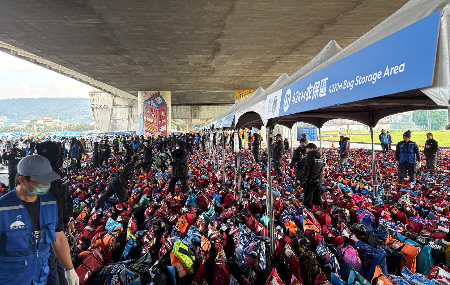 Taipei Standard Chartered 2026 Half Marathon: Part of the mass of dropped-off bags waiting to be picked up at the race finish. Taipei Standard Chartered 2026 Half Marathon: Part of the mass of dropped-off bags waiting to be picked up at the race finish.