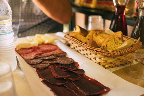 Fruit market, lukumades, olive heaven, koulori, cured meats and spanakopita