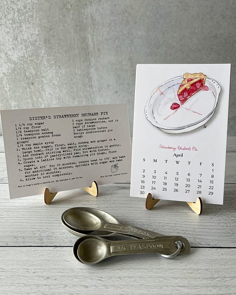 Images of the 2023 pie calendar including illustrations of chicken pot pie, strawberry rhubarb pie, and cherry pie.