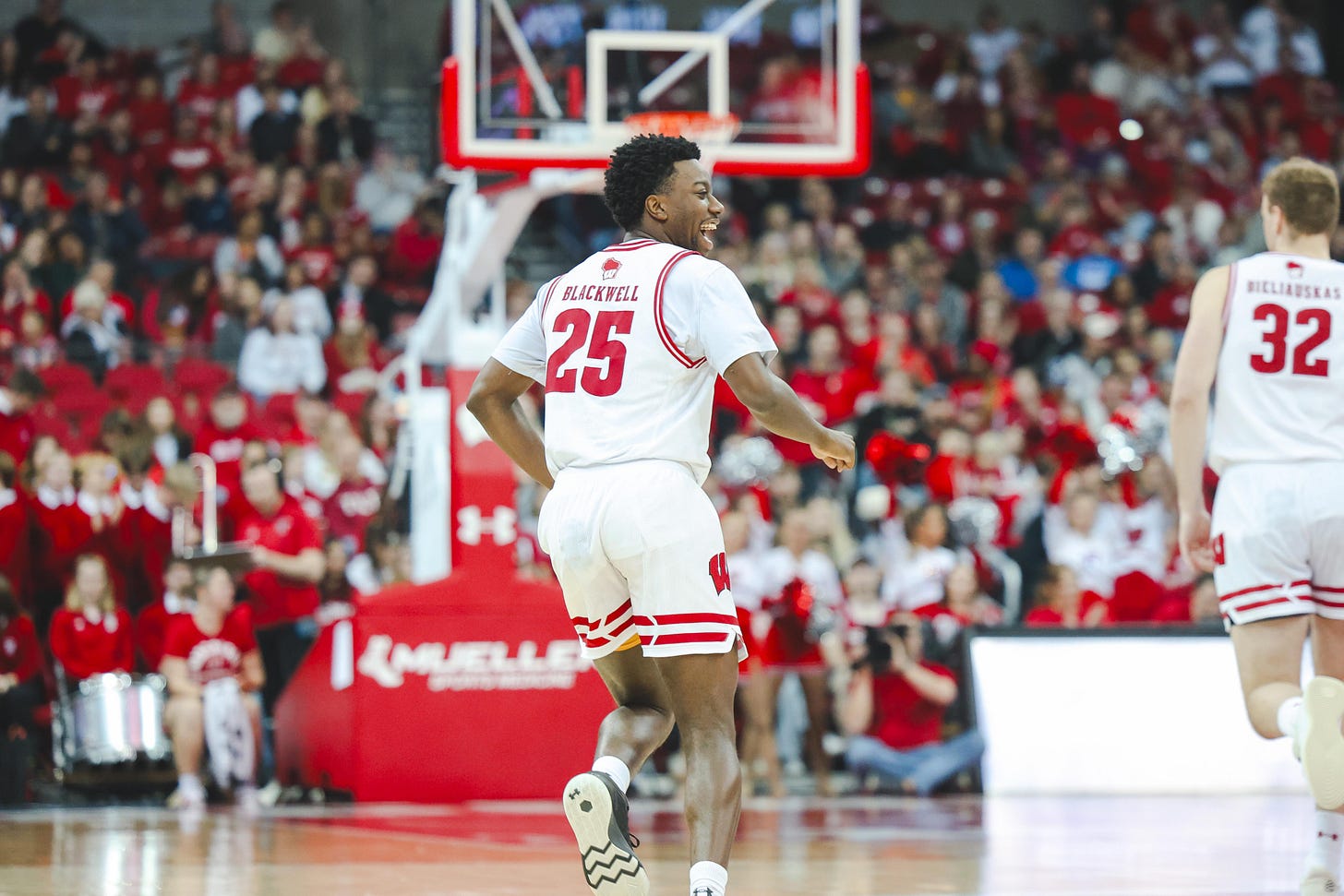 Wisconsin Badgers guard John Blackwell yelling out toward his teammates while running back on defense