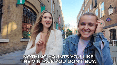 Hannah and Sian on a bench in Covent Garden. Sian is saying, "Nothing haunts you like the vintage you don't buy"