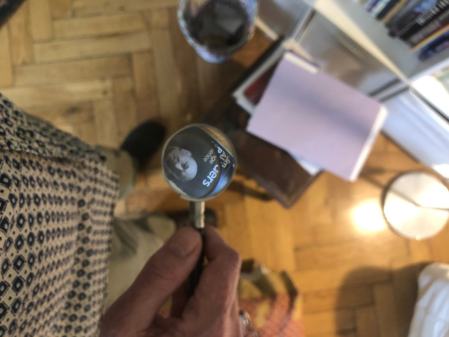 A picture of Jim Al-Khalili's Pathfinders seen through two convex lenses.