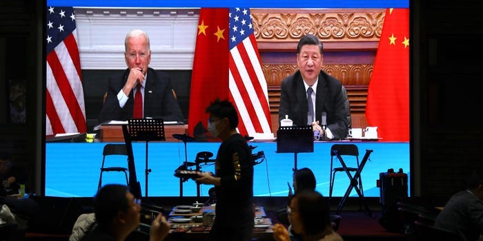 A screen shows Chinese President Xi Jinping attending a virtual meeting with U.S. President Joe Biden via video link, at a restaurant in Beijing, China November 16, 2021.