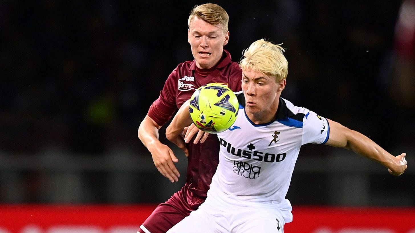 Reported Liverpool target Perr Schuurs defends against Rasmus Hojlund.